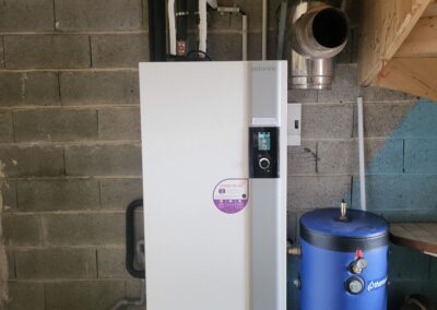 Installation pompe à chaleur Atlantic 14 kW remplacement chaudière bois